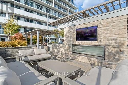 1611 - 65 Speers Road, Oakville, ON - Outdoor With Fireplace