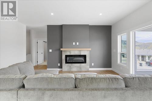 7760 Okanagan Landing Road Unit# 131, Vernon, BC - Indoor Photo Showing Living Room With Fireplace