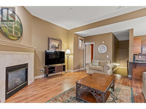 1795 Country Club Drive Unit# 102, Kelowna, BC - Indoor Photo Showing Living Room With Fireplace