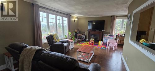 227-229 Main Street, Lewins Cove, NL - Indoor Photo Showing Living Room With Fireplace