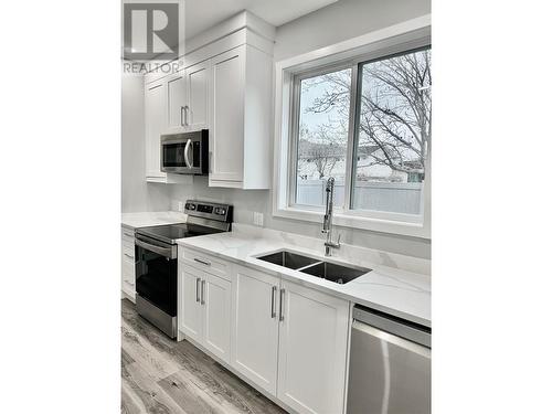 5830 Okanagan Street Unit# 102, Oliver, BC - Indoor Photo Showing Kitchen With Double Sink