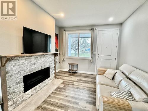 5830 Okanagan Street Unit# 102, Oliver, BC - Indoor Photo Showing Living Room With Fireplace