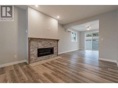 5830 Okanagan Street Unit# 103, Oliver, BC - Indoor Photo Showing Living Room With Fireplace