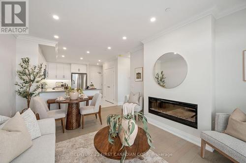 404 - 1560 Upper West Avenue, London, ON - Indoor Photo Showing Living Room With Fireplace