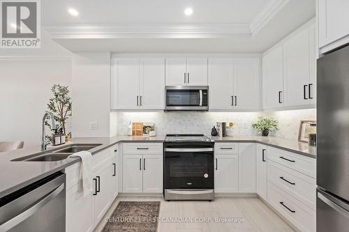 404 - 1560 Upper West Avenue, London, ON - Indoor Photo Showing Kitchen With Stainless Steel Kitchen With Double Sink With Upgraded Kitchen