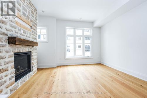 125 - 35 Lunar Crescent, Mississauga, ON - Indoor Photo Showing Living Room With Fireplace