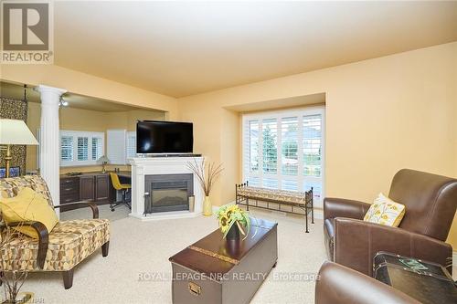 13 Graham Avenue, St. Catharines (438 - Port Dalhousie), ON - Indoor Photo Showing Living Room With Fireplace