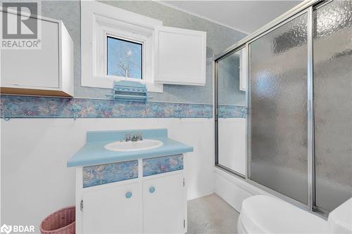 Full bathroom with shower / bath combination with glass door, vanity, and toilet - 14686 County Road 509, Mississippi Station, ON - Indoor Photo Showing Bathroom