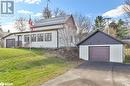 View of side of property with a lawn, a garage, and an outdoor structure - 14686 County Road 509, Mississippi Station, ON  - Outdoor 