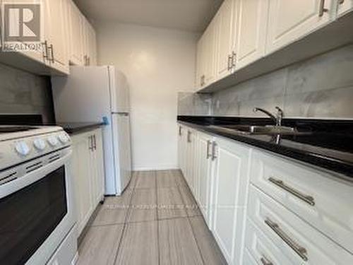 208 - 363 Lakeshore Road E, Mississauga, ON - Indoor Photo Showing Kitchen With Double Sink