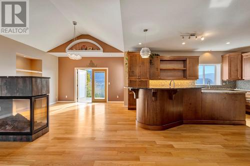 565 San Cabrio Court, Kelowna, BC - Indoor Photo Showing Kitchen With Fireplace