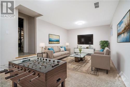 Versatile basement space with access to garage - 1821 Walkley Road Unit#8, Ottawa, ON - Indoor Photo Showing Living Room