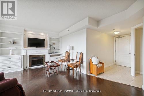 708 - 4640 Kimbermount Avenue, Mississauga, ON - Indoor Photo Showing Living Room With Fireplace