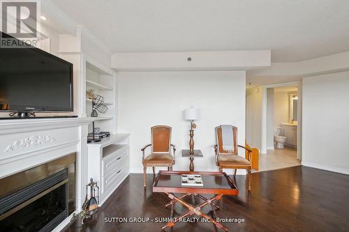 708 - 4640 Kimbermount Avenue, Mississauga, ON - Indoor Photo Showing Living Room With Fireplace