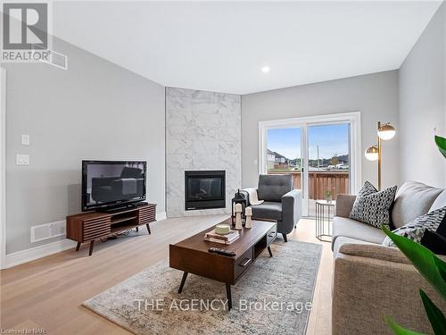 27 Austin Drive, Welland, ON - Indoor Photo Showing Living Room With Fireplace