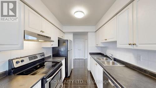 812 - 35 Kingsbridge Gardens, Mississauga, ON - Indoor Photo Showing Kitchen With Double Sink