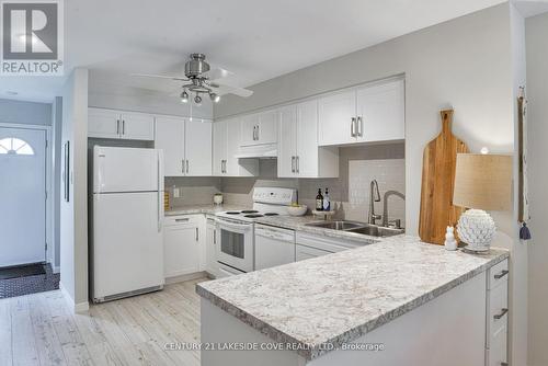 Unit 16 - 2 Paradise Boulevard, Ramara, ON - Indoor Photo Showing Kitchen With Double Sink