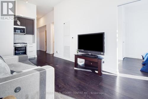 202 - 215 Veterans Drive, Brampton, ON - Indoor Photo Showing Living Room With Fireplace