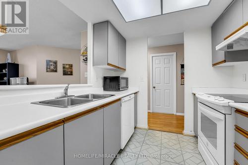 714 - 1001 Cedarglen Gate, Mississauga, ON - Indoor Photo Showing Kitchen With Double Sink