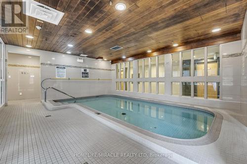 714 - 1001 Cedarglen Gate, Mississauga, ON - Indoor Photo Showing Other Room With In Ground Pool