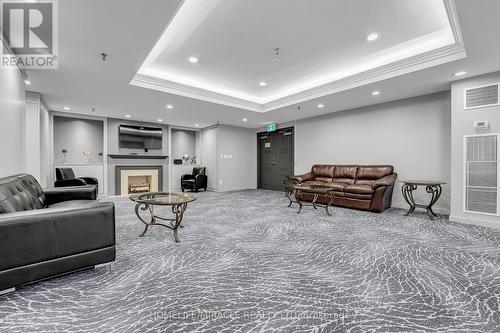 714 - 1001 Cedarglen Gate, Mississauga, ON - Indoor With Fireplace