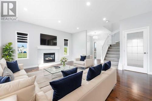 238 Lakeview Inlet, Chestermere, AB - Indoor Photo Showing Living Room With Fireplace