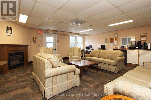 32 Wilmot Trail, Clarington (Newcastle), ON - Indoor Photo Showing Living Room With Fireplace