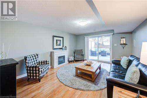 111 King Street E Unit# 9, Ingersoll, ON - Indoor Photo Showing Living Room With Fireplace