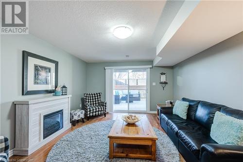 111 King Street E Unit# 9, Ingersoll, ON - Indoor Photo Showing Living Room With Fireplace