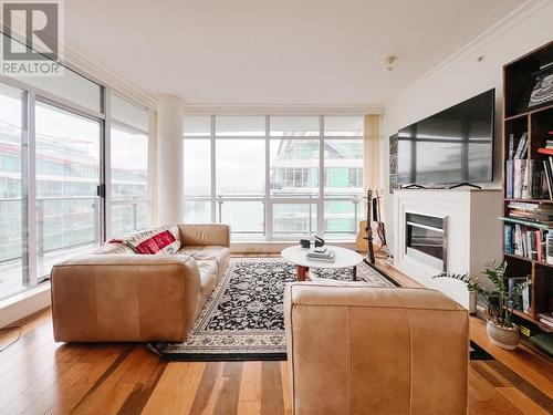 904 162 Victory Ship Way, North Vancouver, BC - Indoor Photo Showing Living Room With Fireplace