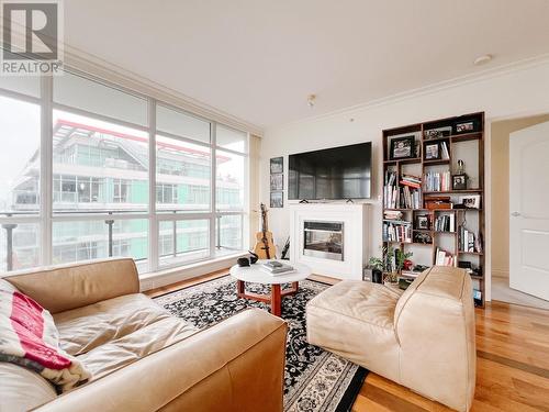 904 162 Victory Ship Way, North Vancouver, BC - Indoor Photo Showing Living Room With Fireplace