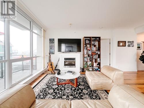 904 162 Victory Ship Way, North Vancouver, BC - Indoor Photo Showing Living Room With Fireplace