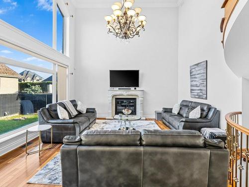 Living room - 256 Rue Des Alismas, Laval (Sainte-Dorothée), QC - Indoor Photo Showing Living Room With Fireplace