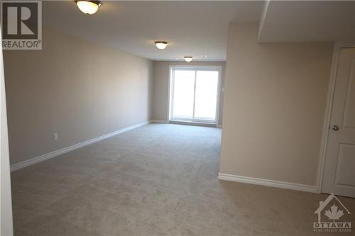 Lower level walk out basement with fireplace - 55 Arkose Street, Kanata, ON - Indoor Photo Showing Other Room