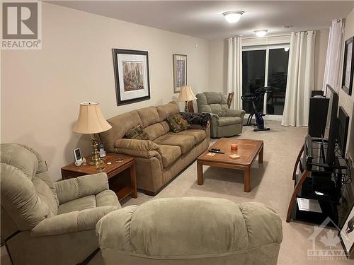 Lower level walk out basement with fireplace - 55 Arkose Street, Kanata, ON - Indoor Photo Showing Living Room