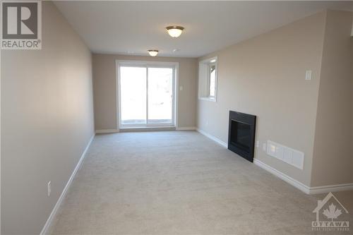 Lower level walk out basement with Fireplace - 55 Arkose Street, Kanata, ON - Indoor Photo Showing Other Room