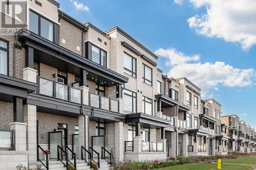 203 - 2550 Castlegate Crossing Drive, Pickering, ON - Outdoor With Balcony With Facade