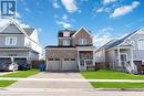 View of front of house with a porch, a garage, and a front lawn - 40 Todd Crescent, Dundalk, ON  - Outdoor With Facade 