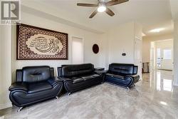 Living room featuring ceiling fan - 