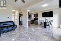 Living room featuring ceiling fan - 