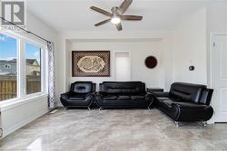 Living room featuring ceiling fan - 