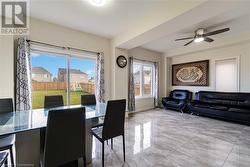 Dining room featuring ceiling fan and a healthy amount of sunlight - 