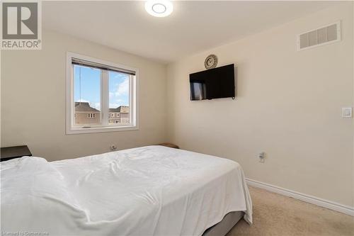 Bedroom with light colored carpet - 40 Todd Crescent, Dundalk, ON - Indoor Photo Showing Bedroom