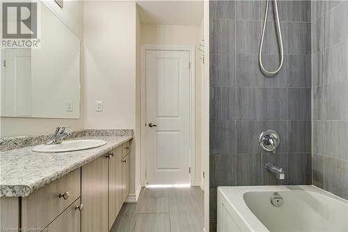 Bathroom with tile patterned flooring, tiled shower / bath combo, and vanity - 40 Todd Crescent, Dundalk, ON - Indoor Photo Showing Bathroom