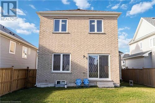 Rear view of property featuring a yard - 40 Todd Crescent, Dundalk, ON - Outdoor With Exterior