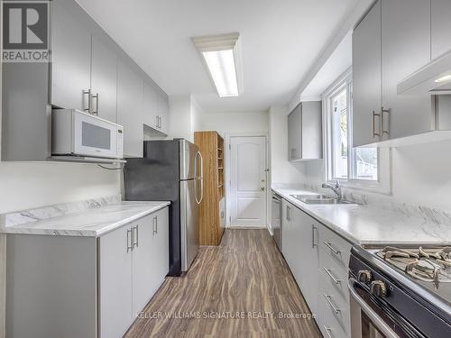 Upper - 66 Craiglee Drive, Toronto, ON - Indoor Photo Showing Kitchen With Double Sink