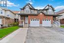 View of front facade with a garage, a porch, and a front yard - 42 Donnenwerth Drive, Kitchener, ON  - Outdoor With Facade 