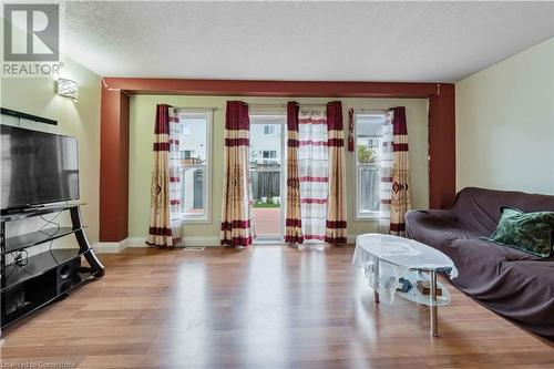 Living room with a textured ceiling and light hardwood / wood-style floors - 42 Donnenwerth Drive, Kitchener, ON - Indoor Photo Showing Living Room