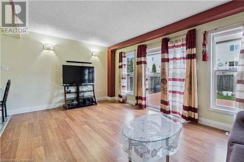 Living room with a textured ceiling and light wood-type flooring - 42 Donnenwerth Drive, Kitchener, ON - Indoor Photo Showing Living Room