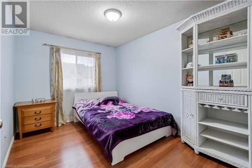 Bedroom featuring a textured ceiling and hardwood / wood-style flooring - 42 Donnenwerth Drive, Kitchener, ON - Indoor Photo Showing Bedroom